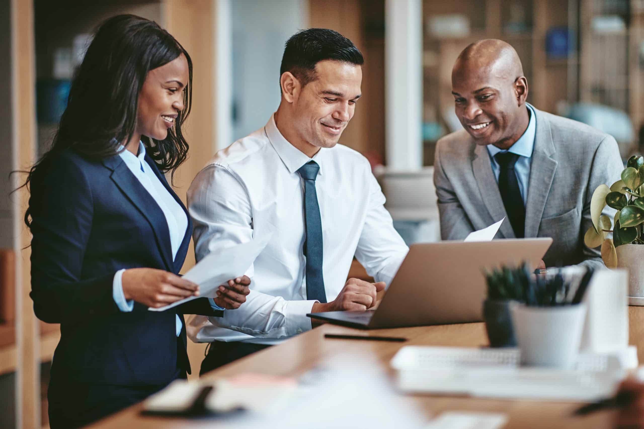 Financial professionals analyzing spreadsheets and data, strategizing for a successful carve-out and sale. Optimizing financial structures, due diligence, and valuation for private equity transactions.